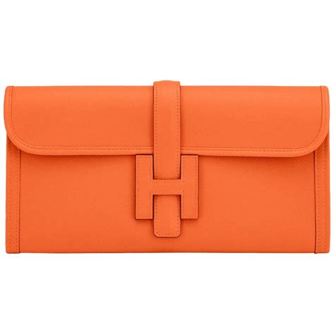 orange hermes clutch